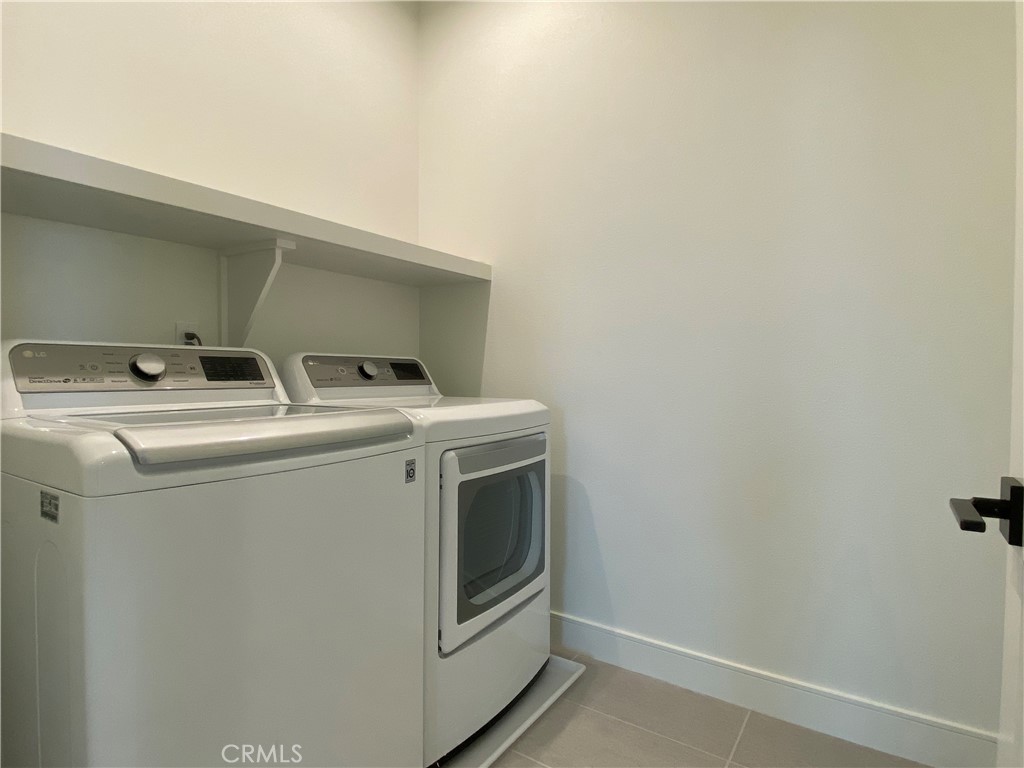 120 Spotted Quail Irvine, CA 92618 - Photo 23 of 32 a utility room with dryer and washer