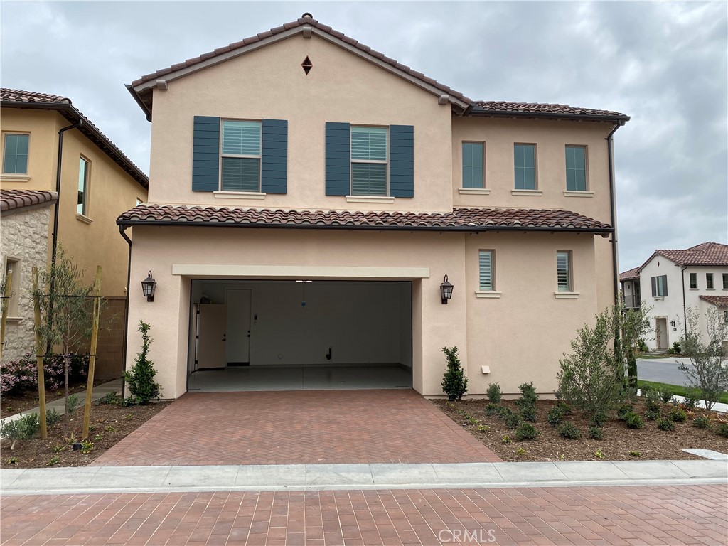 120 Spotted Quail Irvine, CA 92618 - Photo 27 of 32 a house view with a outdoor space