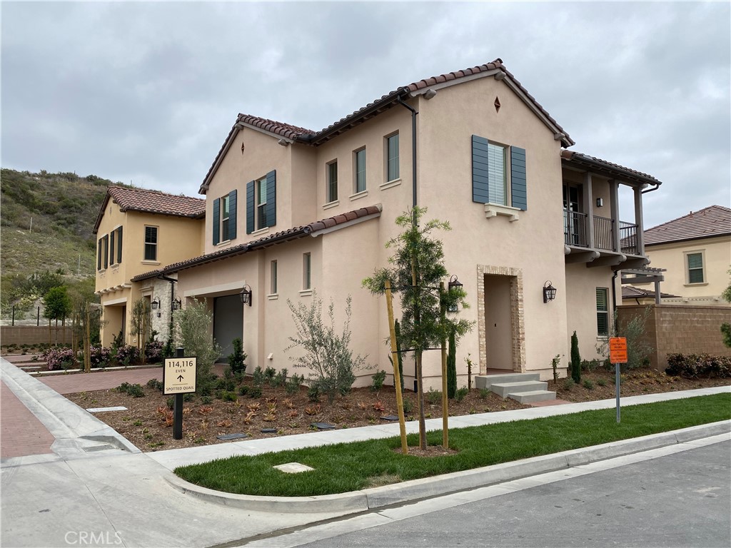 120 Spotted Quail Irvine, CA 92618 - Photo 28 of 32 a front view of a house with garden