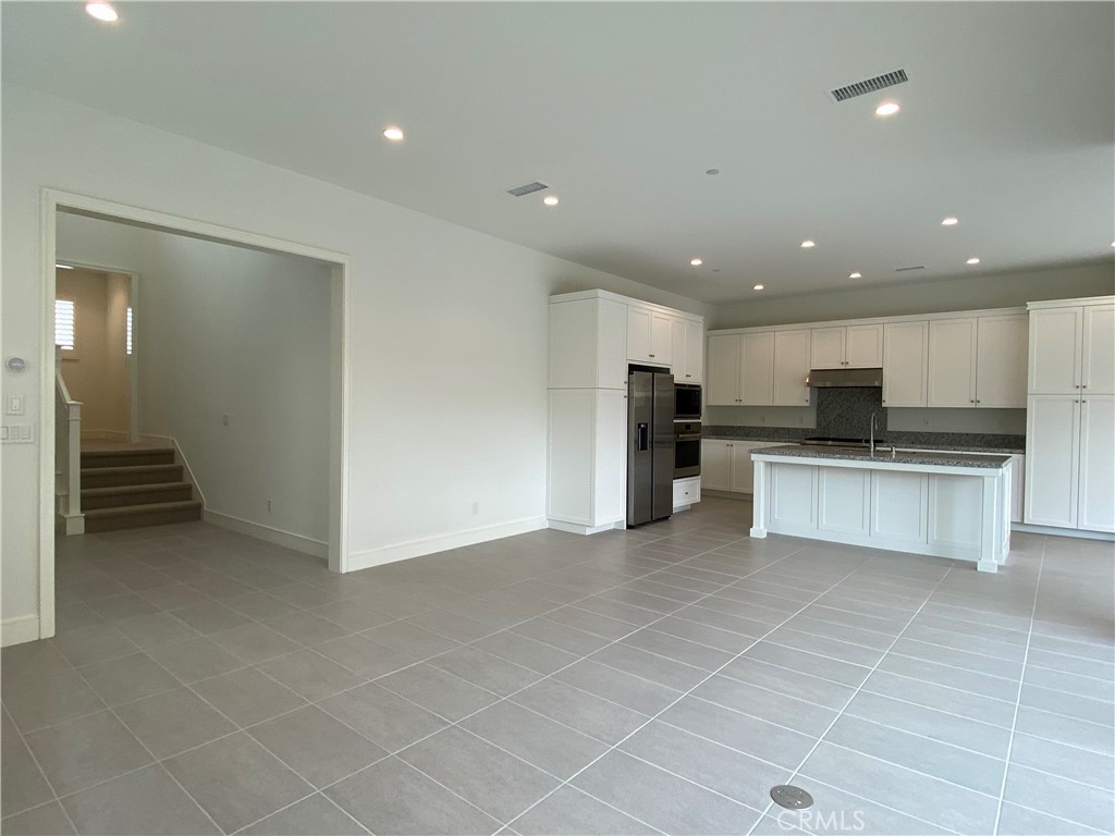 120 Spotted Quail Irvine, CA 92618 - Photo 5 of 32 a view of kitchen with refrigerator and microwave
