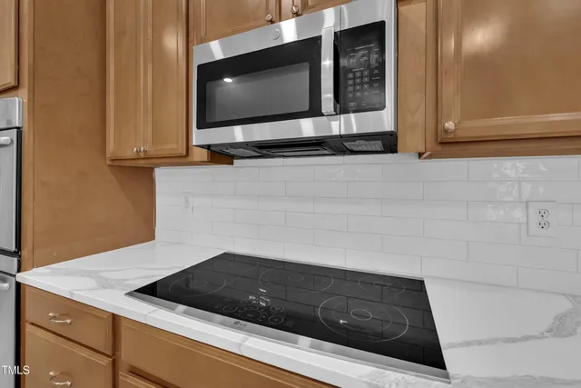 a kitchen with a sink and a microwave