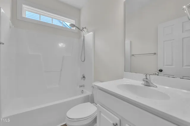 a bathroom with a sink a toilet and a bathtub