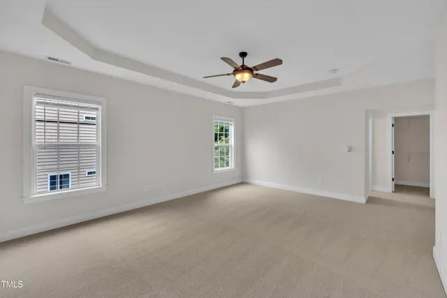 a view of empty room with windows