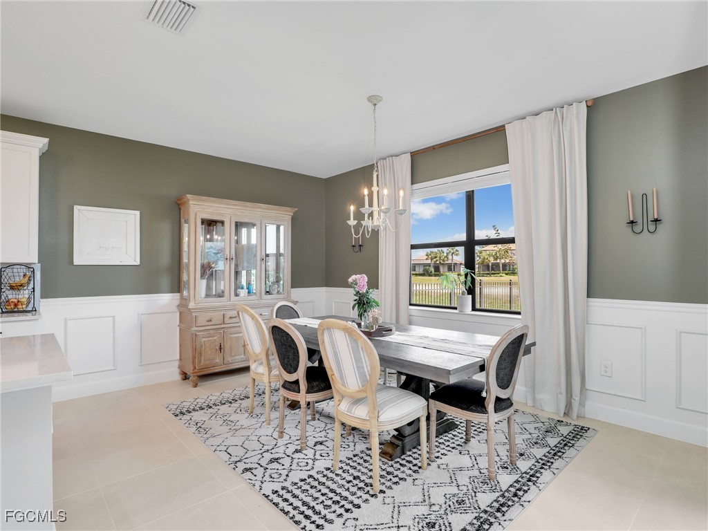 20179 Napa Loop Estero, FL 33928 - Photo 18 of 49 a view of a dining room with furniture and window