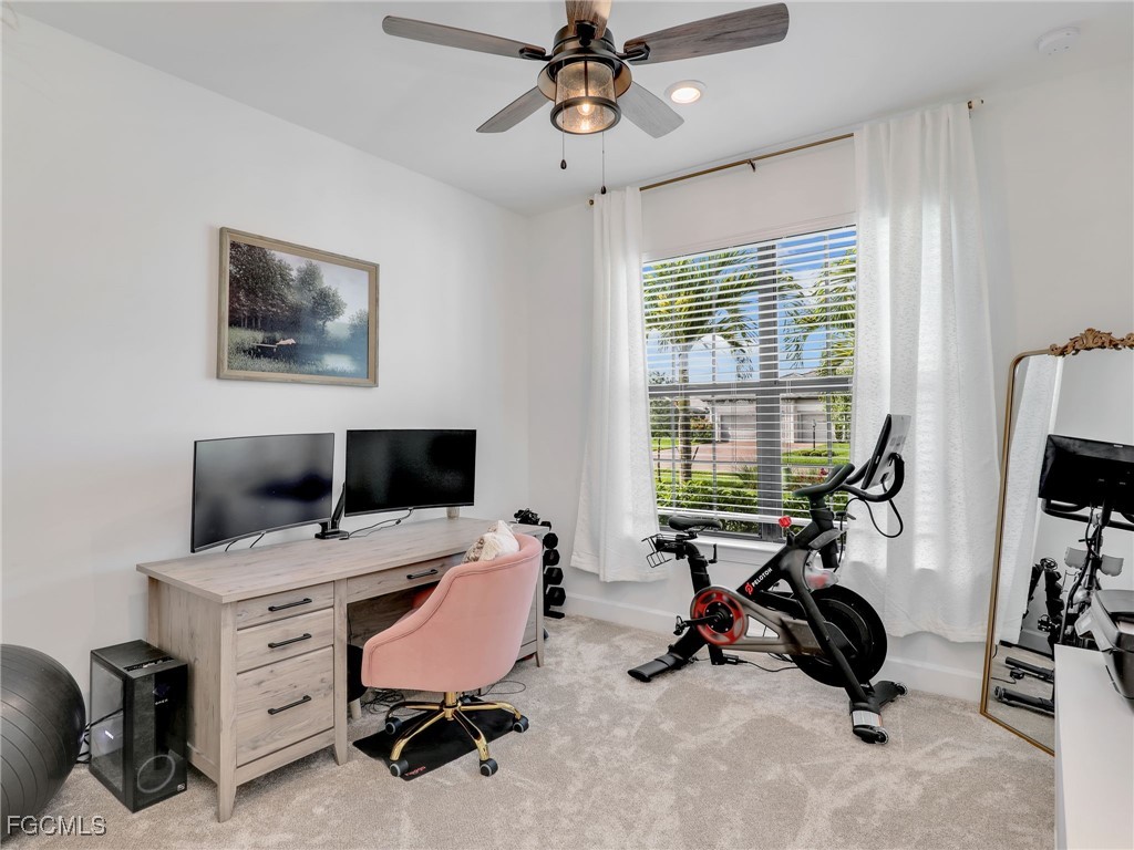 20179 Napa Loop Estero, FL 33928 - Photo 20 of 49 a view of a workspace with furniture and a window