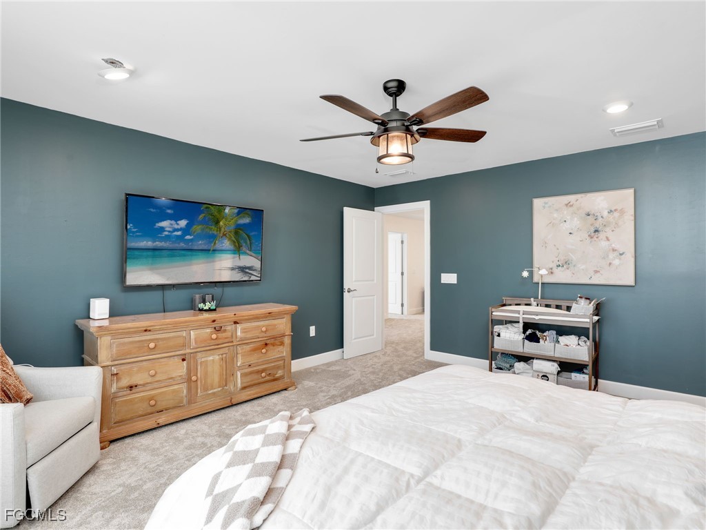20179 Napa Loop Estero, FL 33928 - Photo 24 of 49 a bedroom with a bed and furniture
