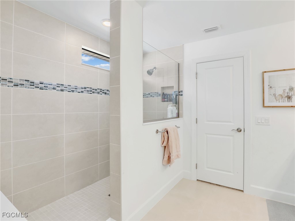 20179 Napa Loop Estero, FL 33928 - Photo 26 of 49 a bathroom with a shower
