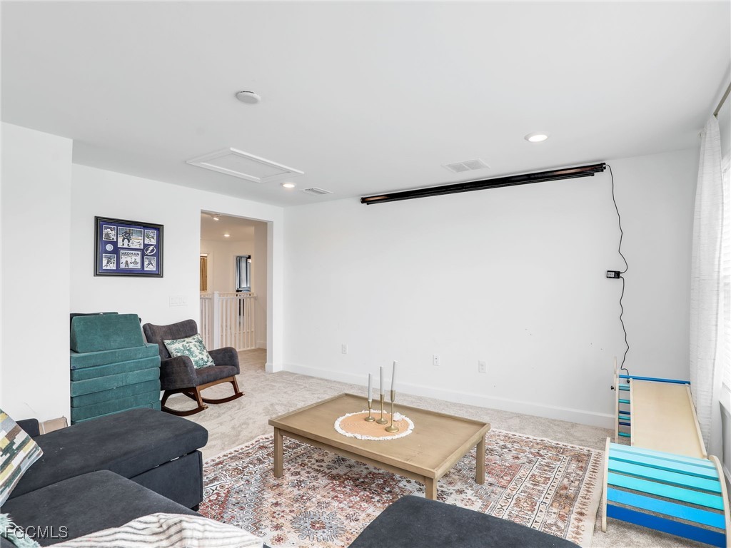 20179 Napa Loop Estero, FL 33928 - Photo 28 of 49 a living room with furniture and a wooden floor