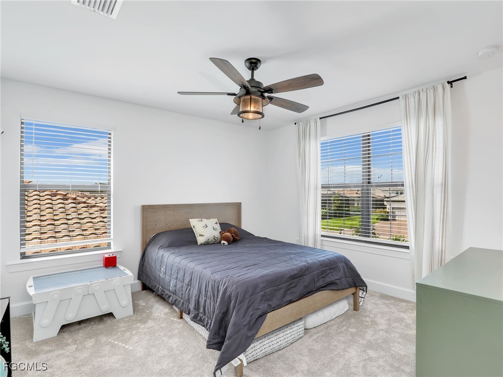 20179 Napa Loop Estero, FL 33928 - Photo 29 of 49 a bedroom with a bed and a window
