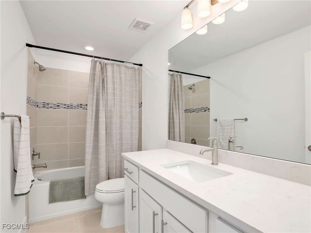 20179 Napa Loop Estero, FL 33928 - Photo 31 of 49 a bathroom with a sink a toilet and shower