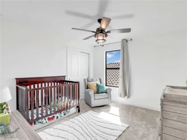 a bedroom with furniture and window
