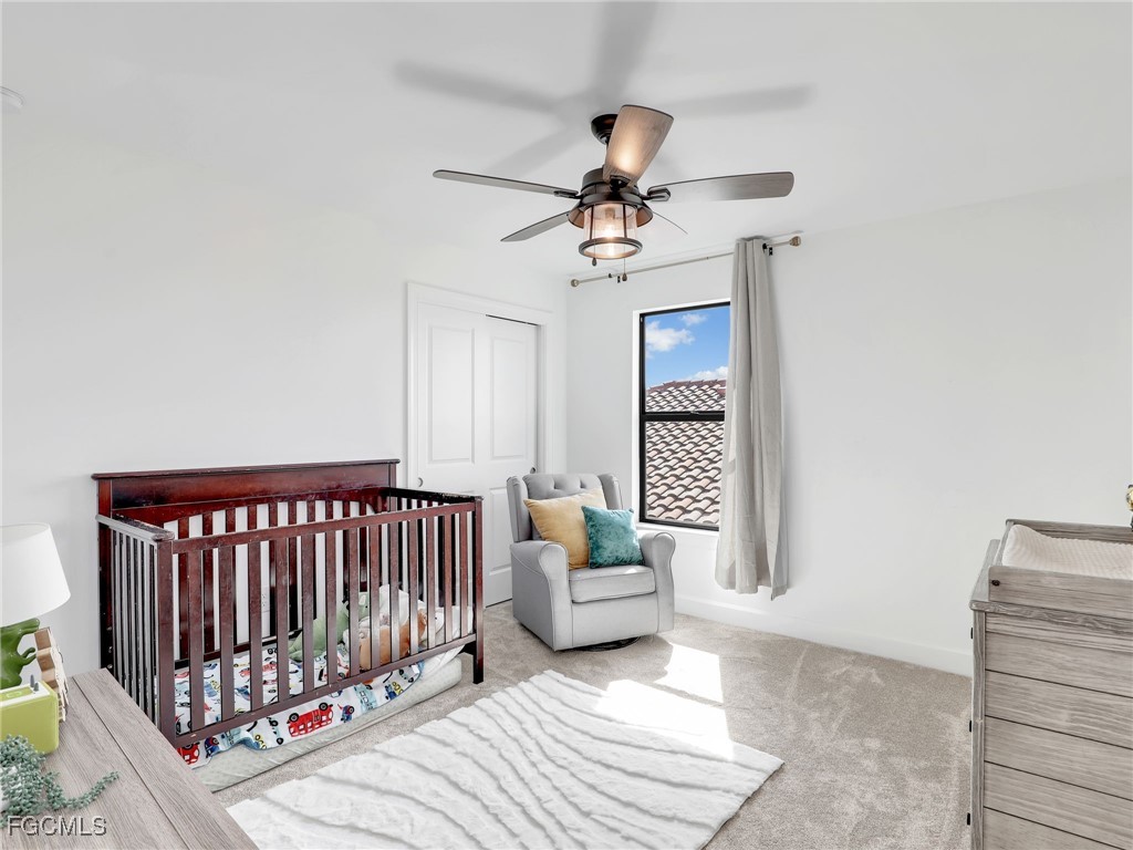 20179 Napa Loop Estero, FL 33928 - Photo 34 of 49 a bedroom with furniture and window