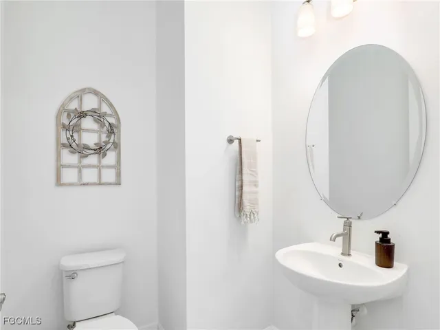 a bathroom with a toilet and a sink