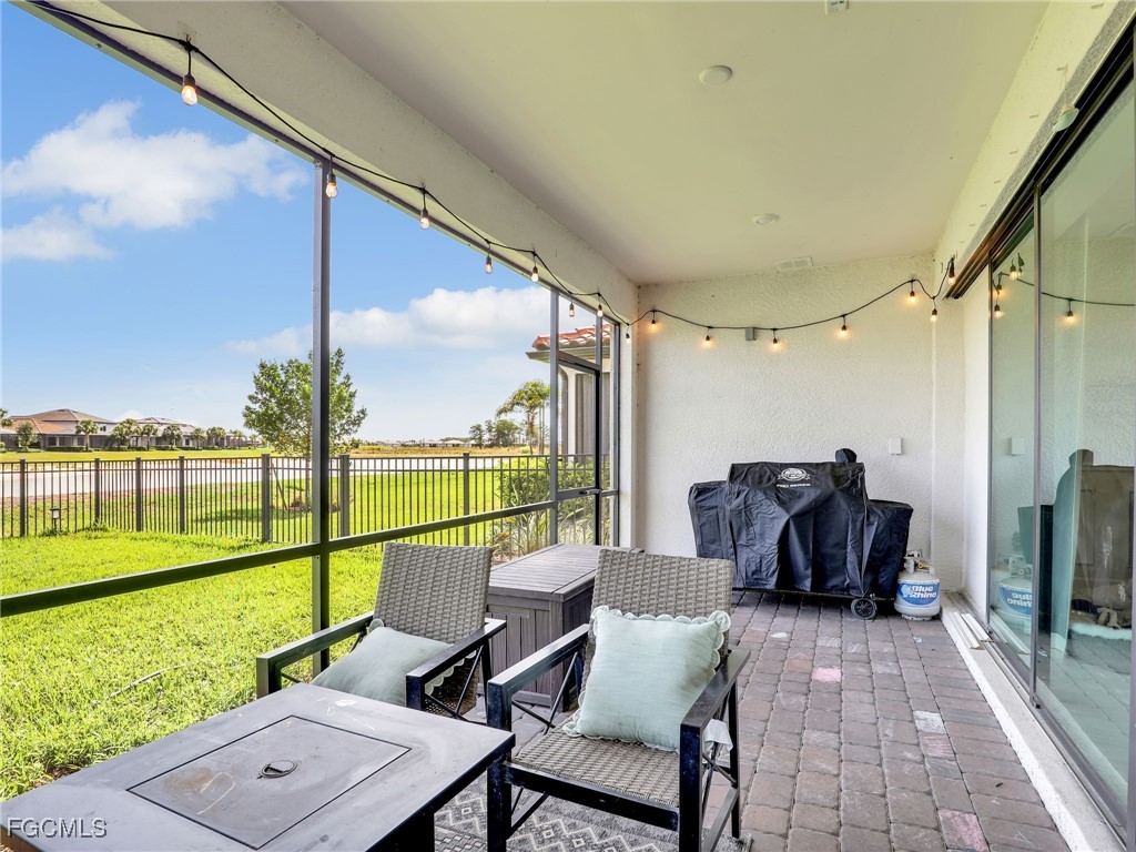 20179 Napa Loop Estero, FL 33928 - Photo 36 of 49 a view of a patio with garden