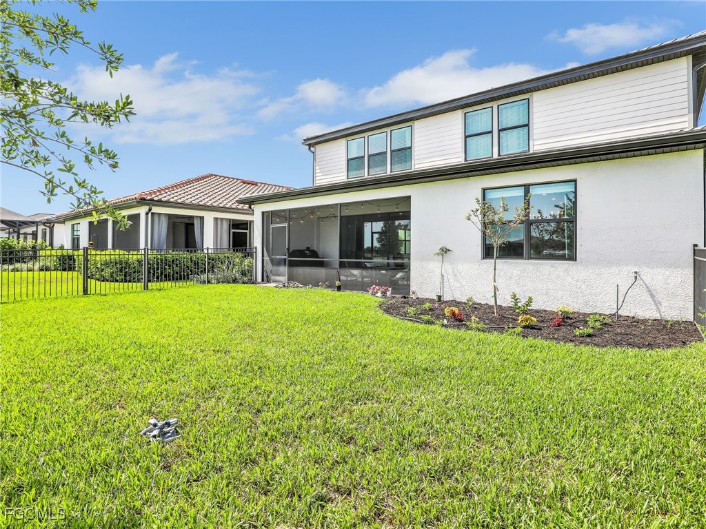 20179 Napa Loop Estero, FL 33928 - Photo 37 of 49 a front view of house with yard and green space