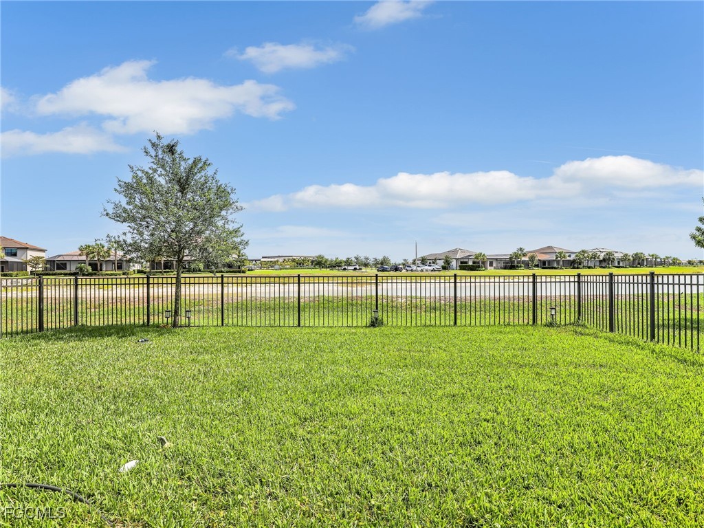 20179 Napa Loop Estero, FL 33928 - Photo 38 of 49 a view of a backyard with plants and trees