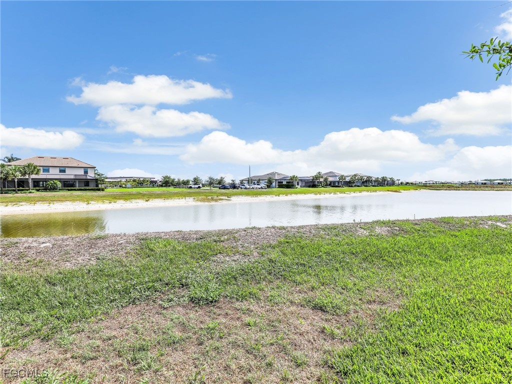 20179 Napa Loop Estero, FL 33928 - Photo 40 of 49 a view of a lake with houses in the back