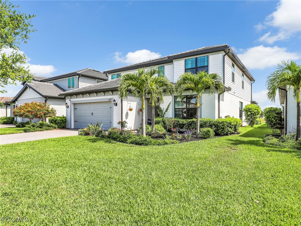 20179 Napa Loop Estero, FL 33928 - Photo 49 of 49 a front view of a house with garden