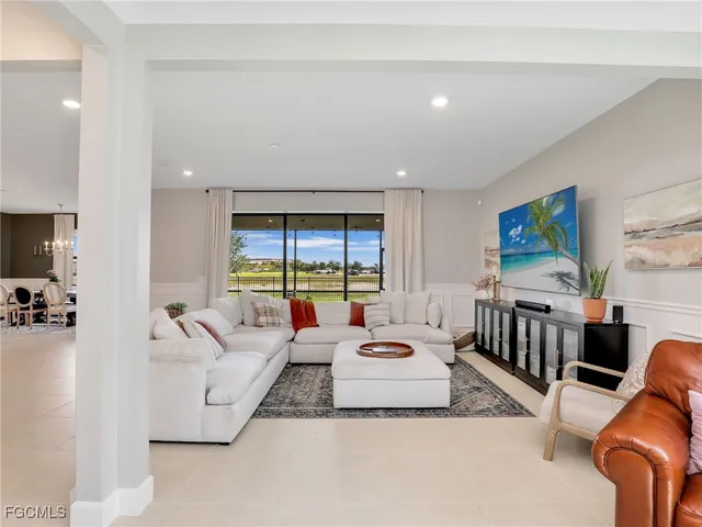 a living room with furniture fireplace and flat screen tv