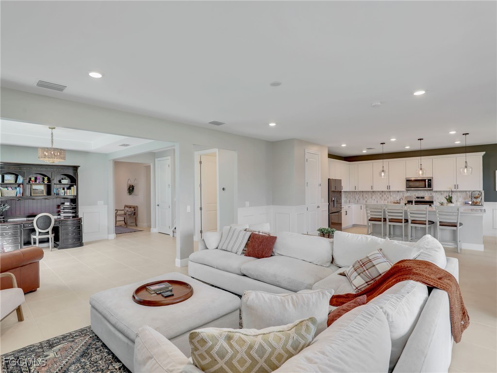 20179 Napa Loop Estero, FL 33928 - Photo 8 of 49 a living room with furniture and a table