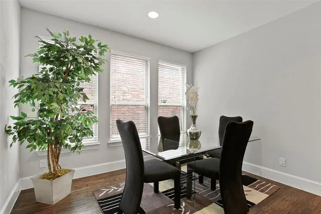 a view of a dining room with furniture and window