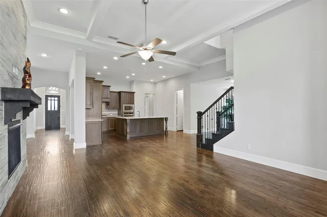 a view of kitchen with cabinets and wooden floor