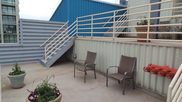 40 East 9th Street, Unit 1604 Chicago, IL 60605 - Photo 24 of 25 a view of a chairs and table in the back yard of the house