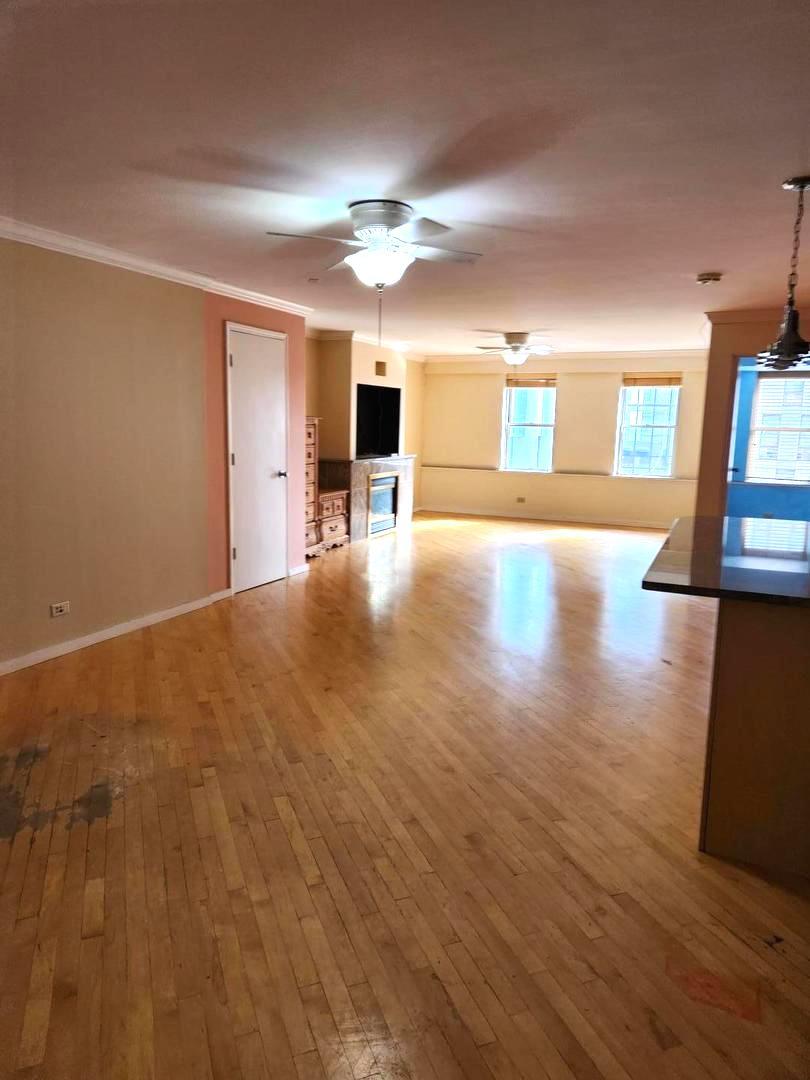 40 East 9th Street, Unit 1604 Chicago, IL 60605 - Photo 7 of 25 a view of empty room with wooden floor