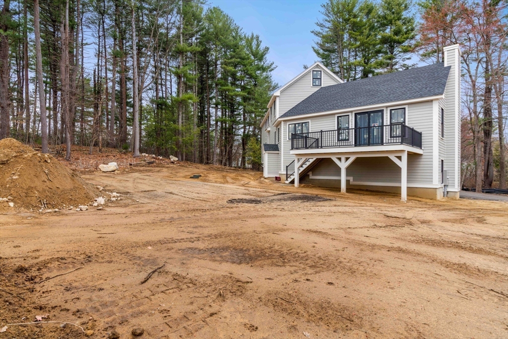 28 Nutter Road North Reading, MA 01864 - Photo 4 of 7 a front view of a house with a yard and garage