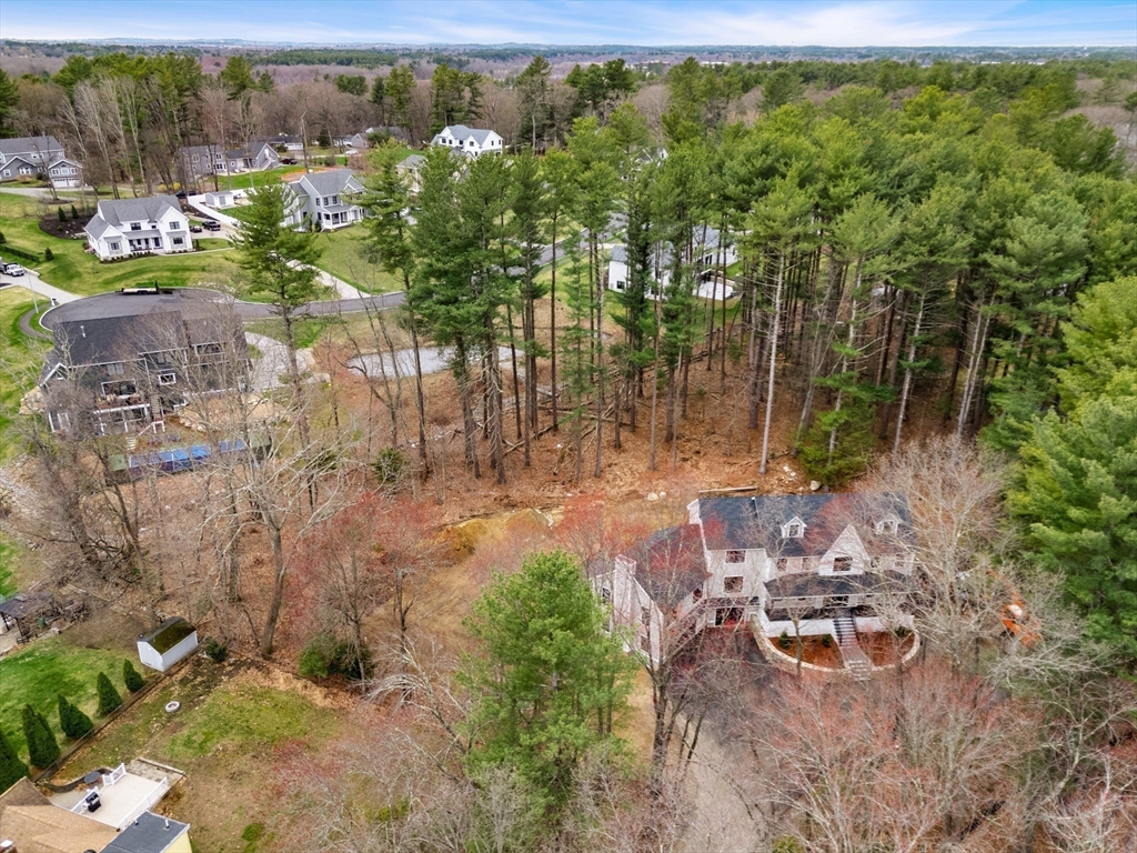 28 Nutter Road North Reading, MA 01864 - Photo 6 of 7 a backyard of a house with lots of green space and fountain