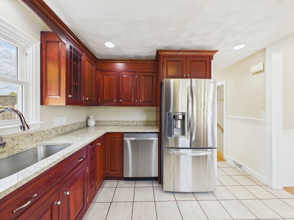786 Wildwood Road New Bedford, MA 02745 - Photo 14 of 39 a kitchen with stainless steel appliances granite countertop a refrigerator sink and cabinets