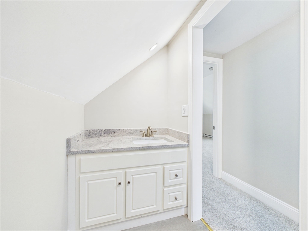 786 Wildwood Road New Bedford, MA 02745 - Photo 20 of 39 a bathroom with a granite countertop sink and a mirror