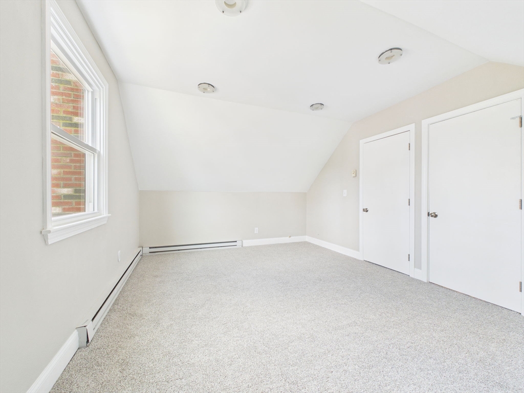 786 Wildwood Road New Bedford, MA 02745 - Photo 22 of 39 a view of an empty room with a window