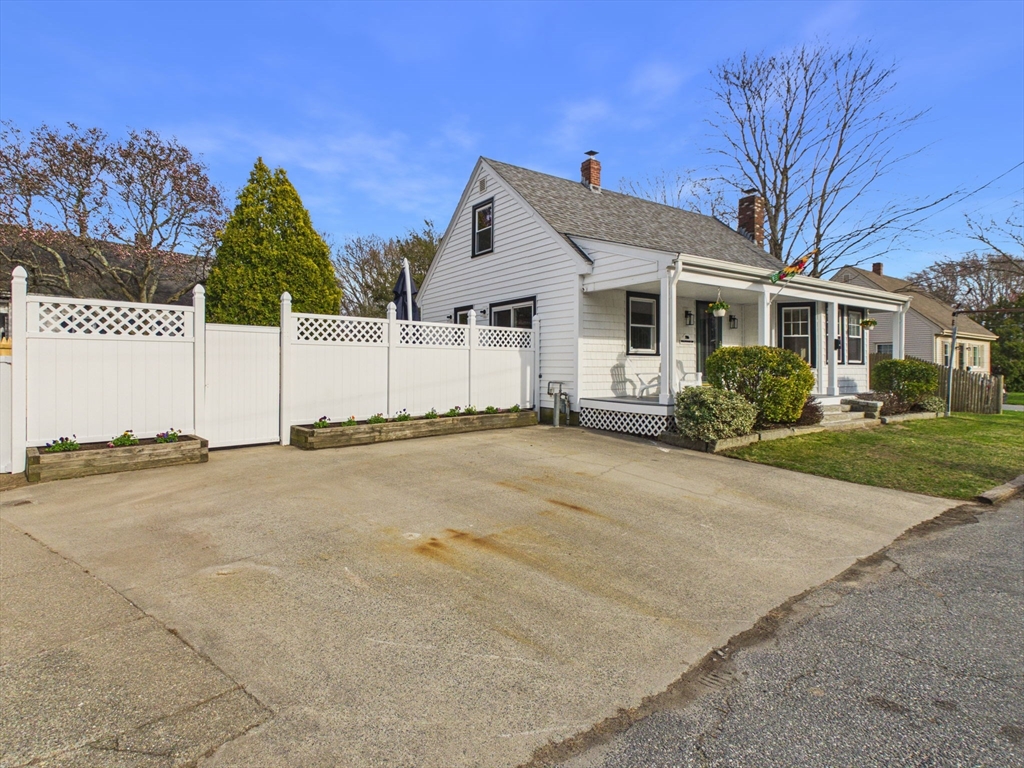 786 Wildwood Road New Bedford, MA 02745 - Photo 3 of 39 a view of a house with a yard