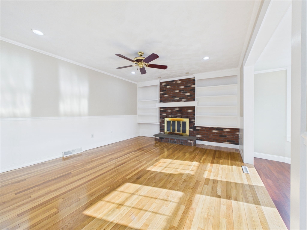 786 Wildwood Road New Bedford, MA 02745 - Photo 4 of 39 a view of a livingroom with a hall and wooden floor