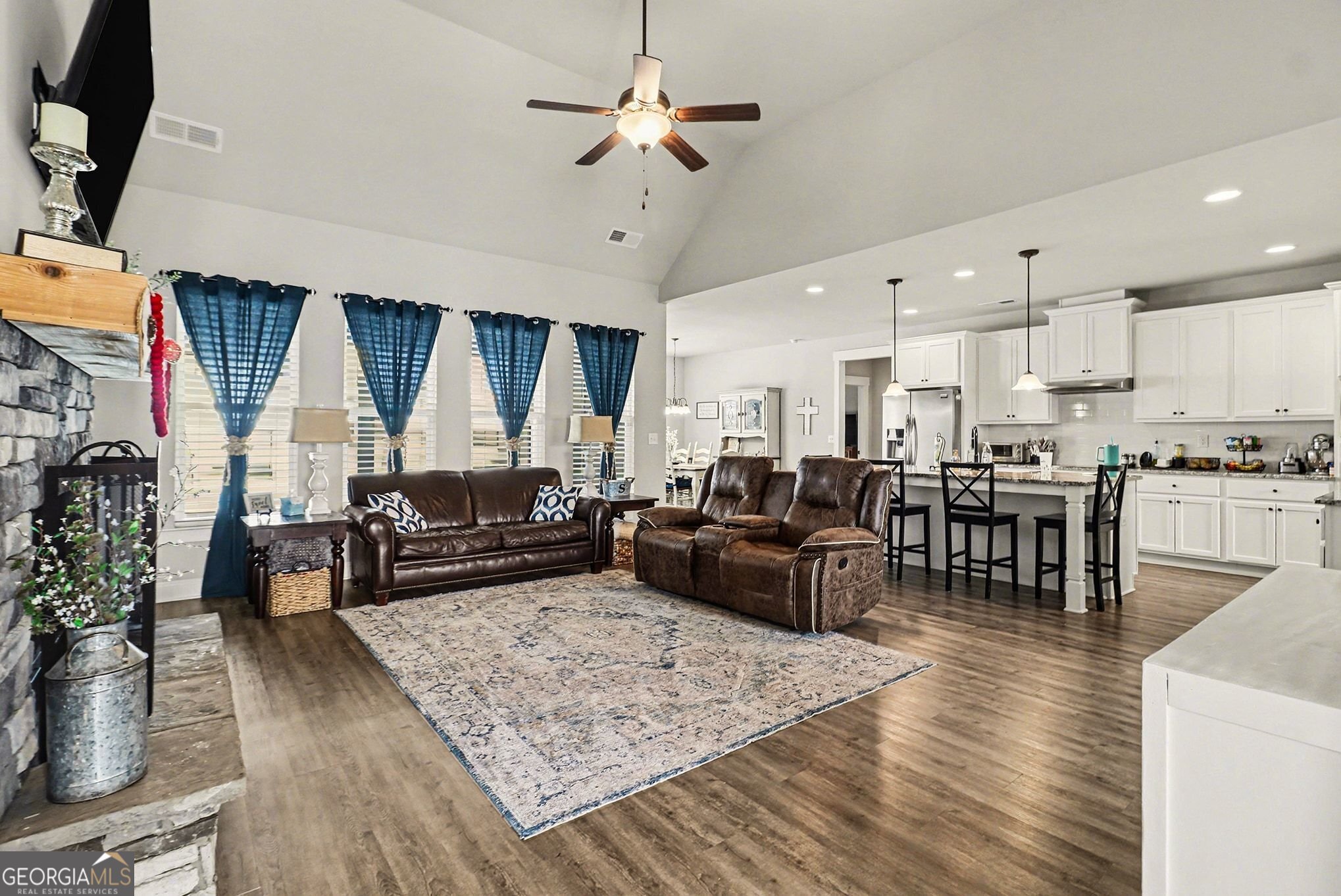 9 Union Street Newnan, GA 30263 - Photo 11 of 31 a living room with furniture kitchen view and a wooden floor