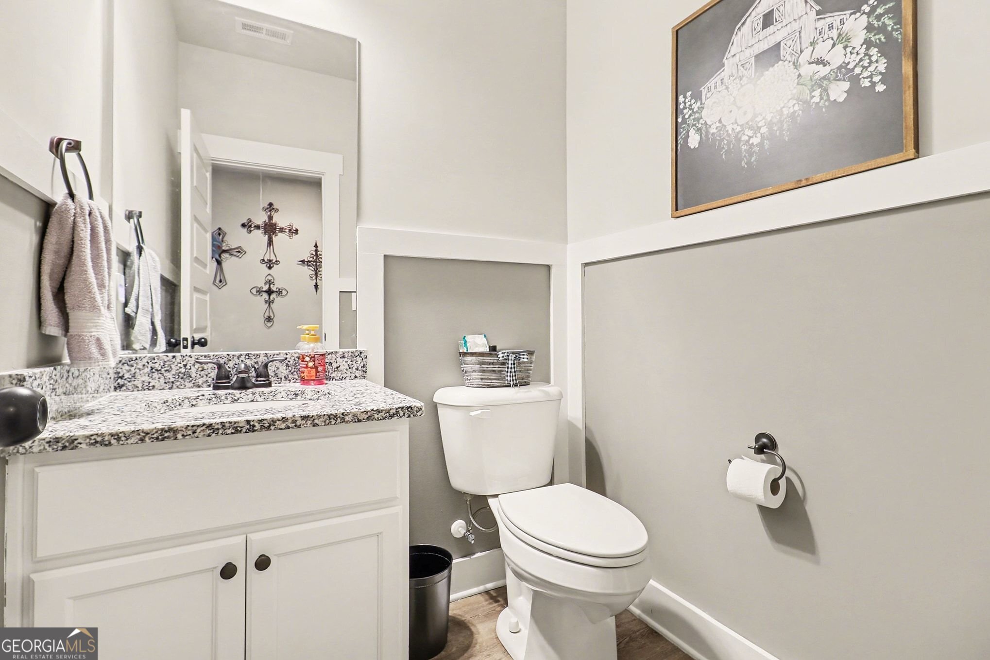 9 Union Street Newnan, GA 30263 - Photo 18 of 31 a bathroom with a granite countertop sink mirror vanity and toilet