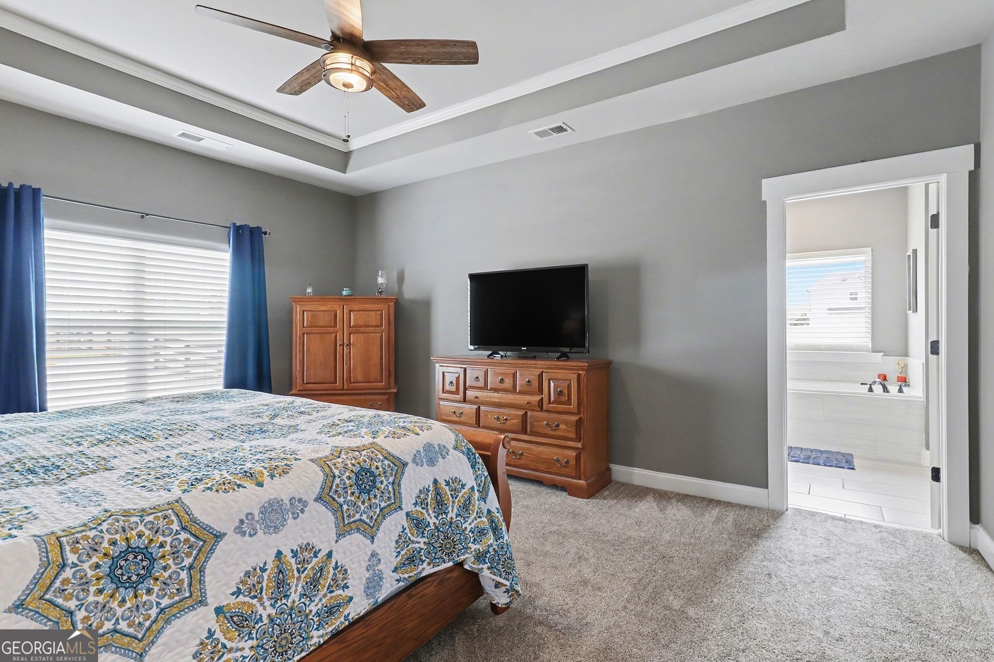 9 Union Street Newnan, GA 30263 - Photo 19 of 31 a bedroom with a bed and a flat screen tv