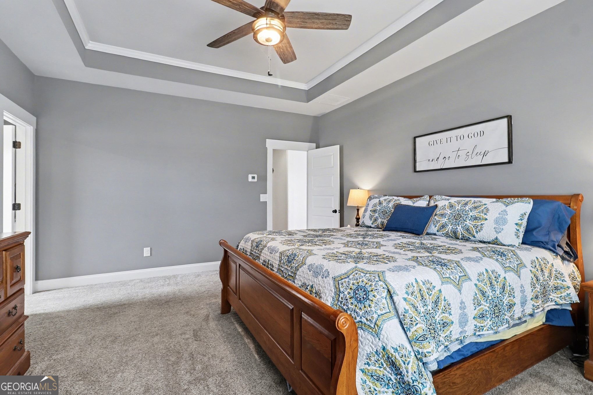 9 Union Street Newnan, GA 30263 - Photo 20 of 31 a bedroom with a bed and a chandelier