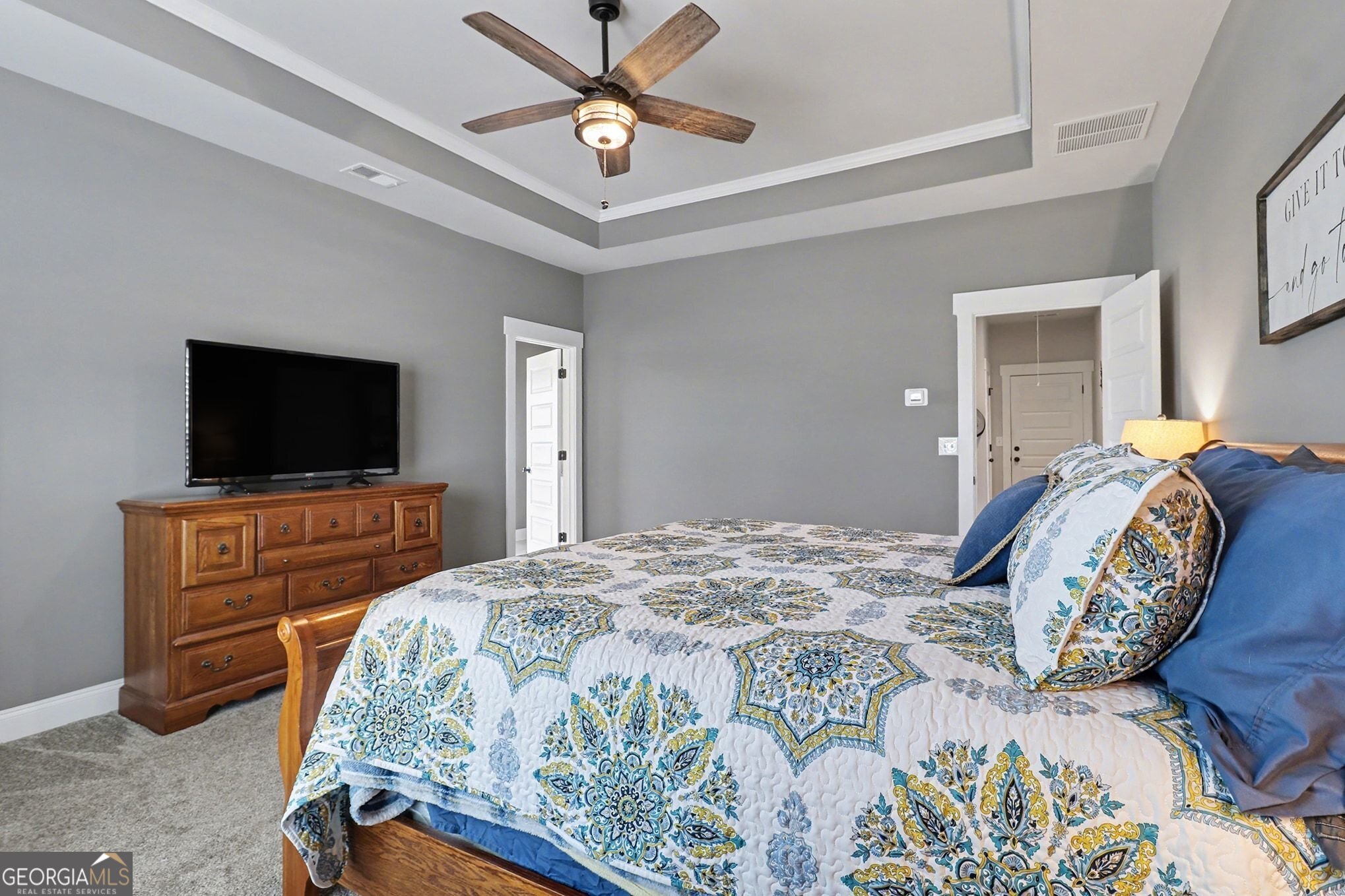 9 Union Street Newnan, GA 30263 - Photo 21 of 31 a bedroom with a bed and a flat screen tv