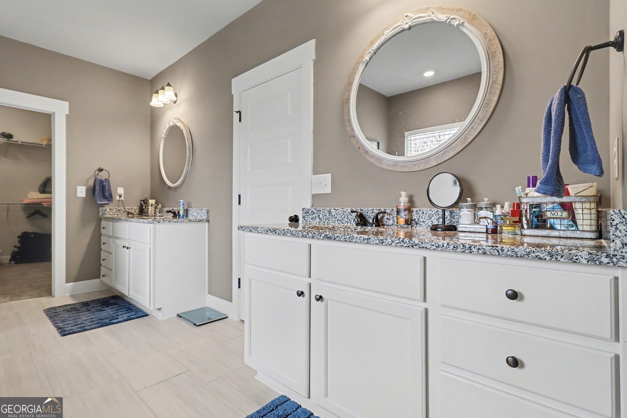 9 Union Street Newnan, GA 30263 - Photo 22 of 31 a bathroom with a double vanity sink and a mirror