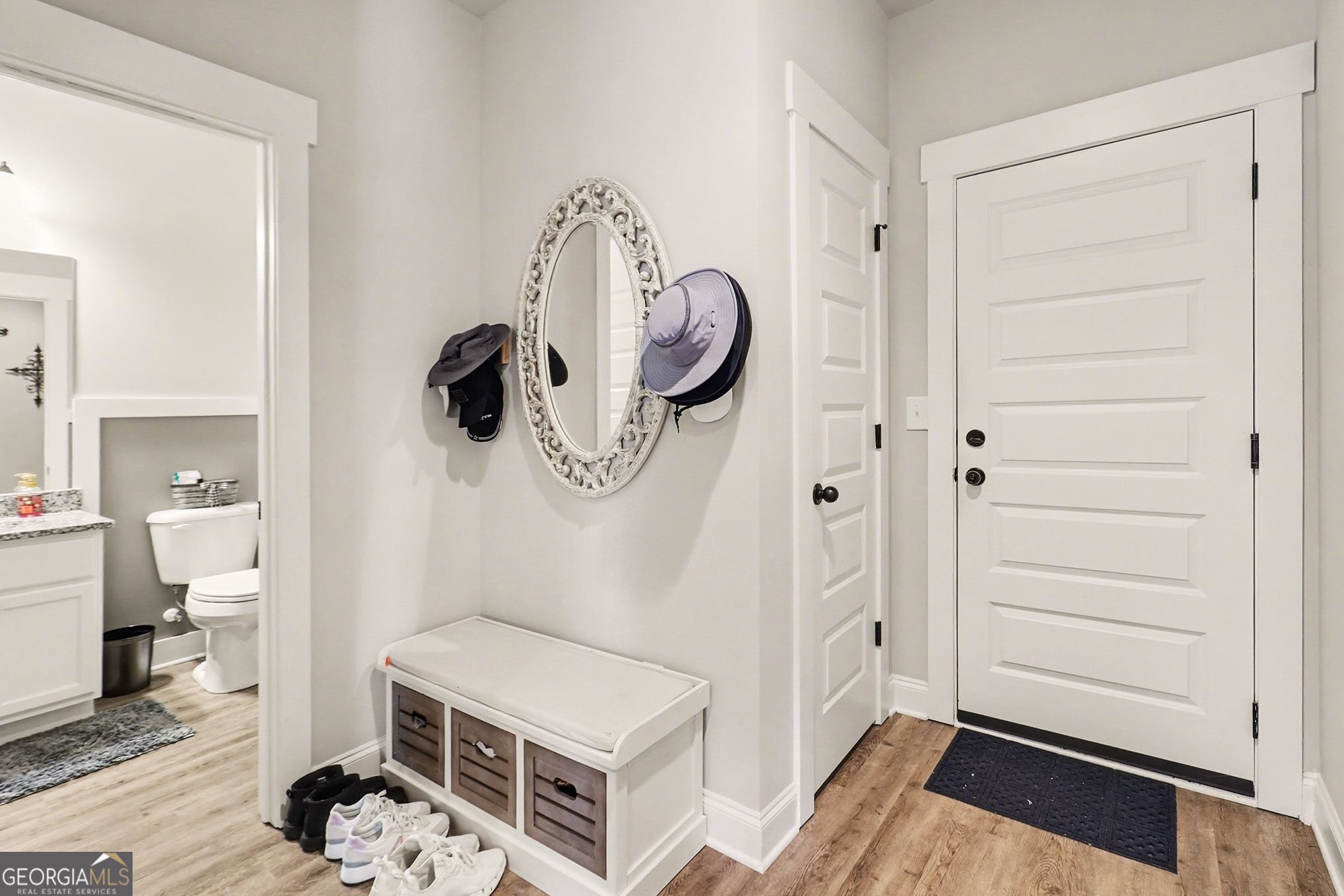 9 Union Street Newnan, GA 30263 - Photo 24 of 31 a hallway with white cabinets and wooden floor