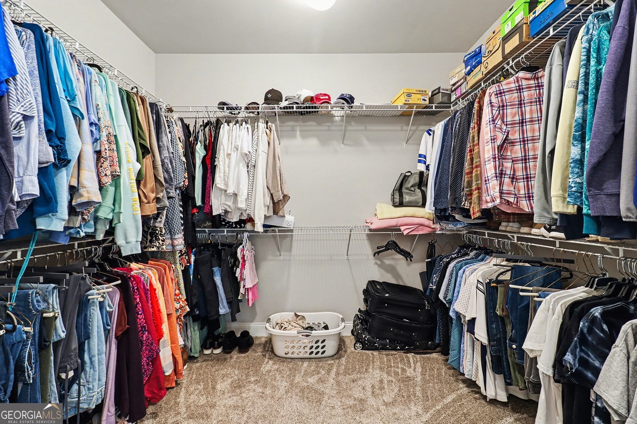 9 Union Street Newnan, GA 30263 - Photo 25 of 31 a view of walk in closet with clothes and shoes
