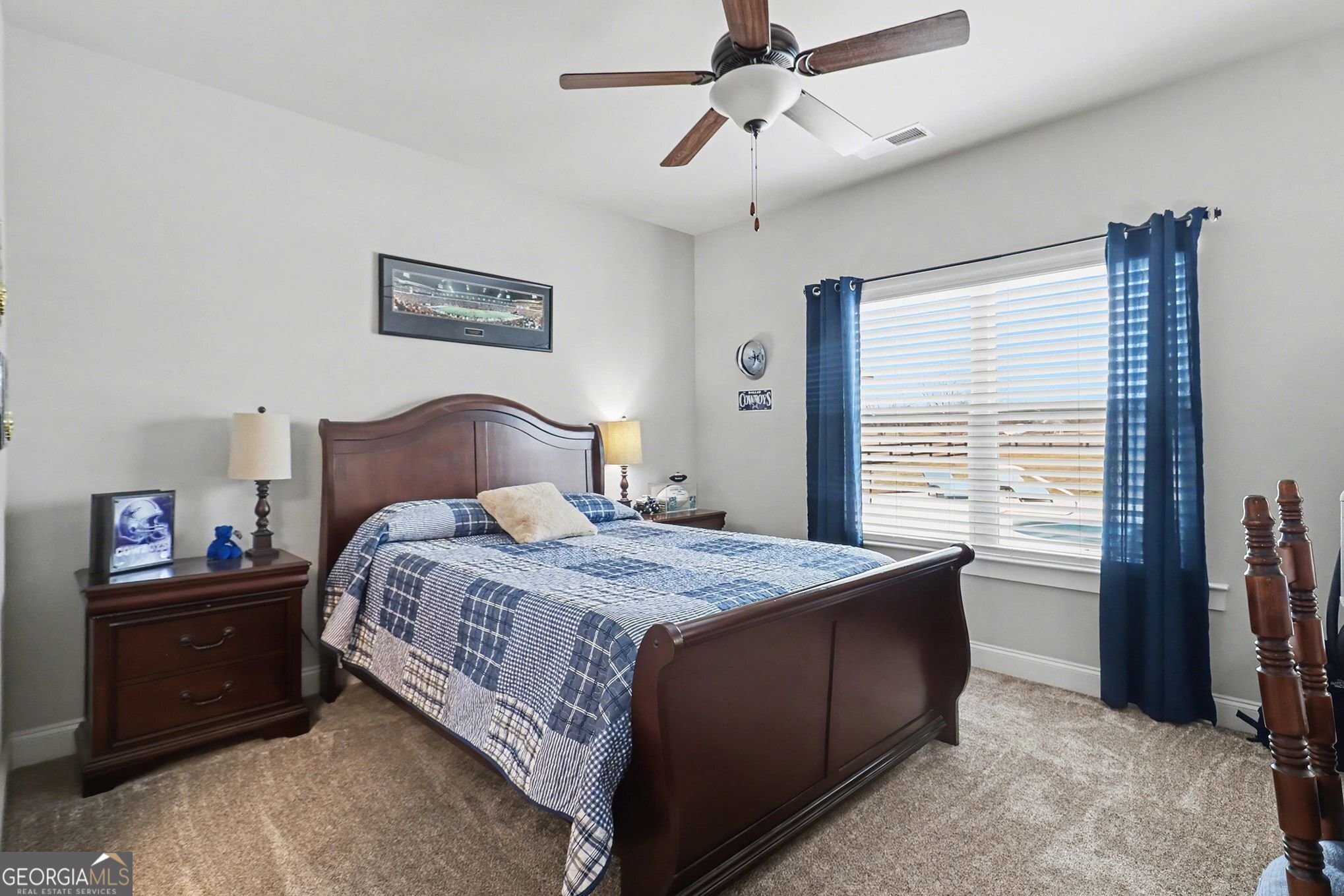 9 Union Street Newnan, GA 30263 - Photo 27 of 31 a bedroom with a bed and a chandelier