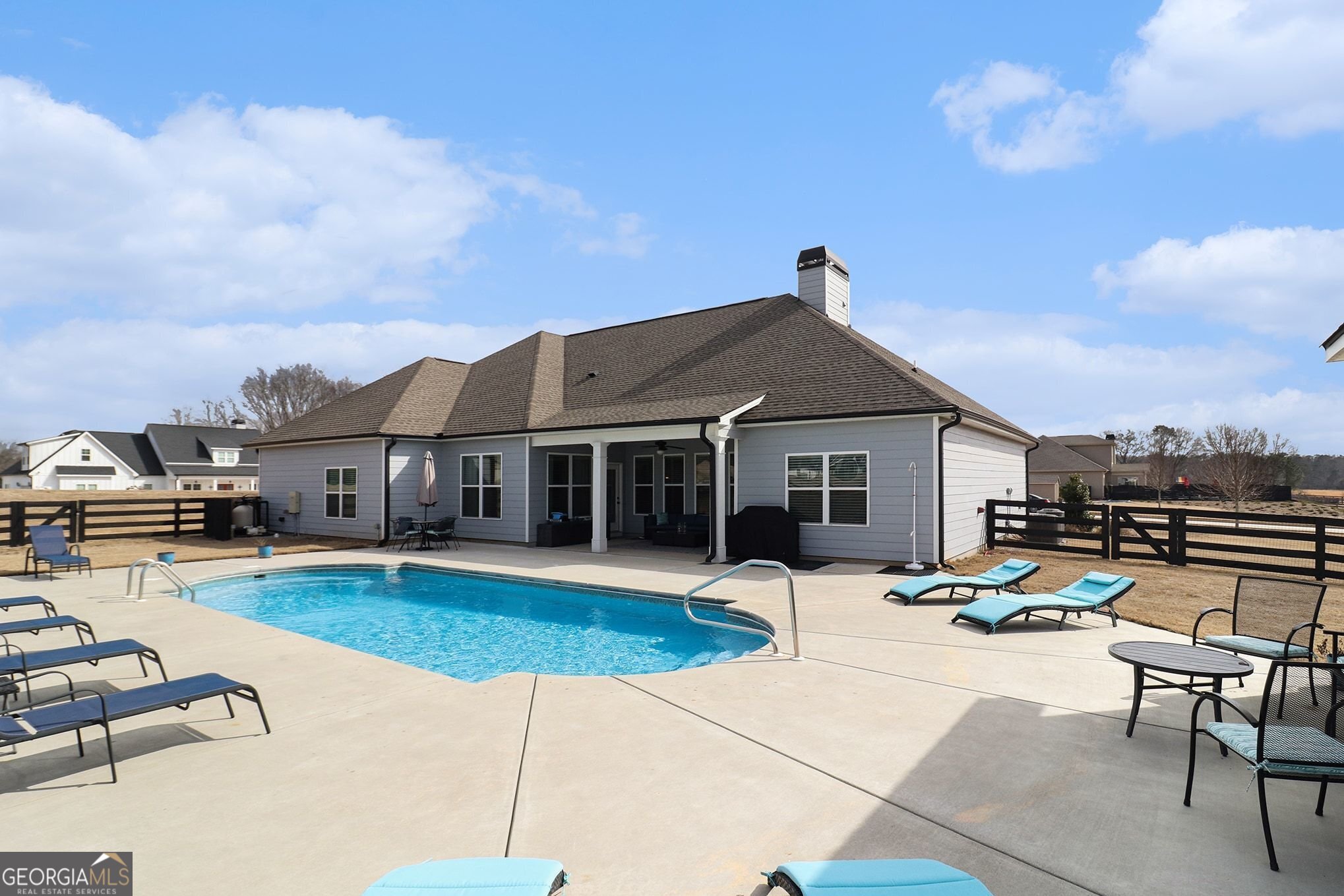 9 Union Street Newnan, GA 30263 - Photo 7 of 31 a swimming pool with outdoor seating and yard