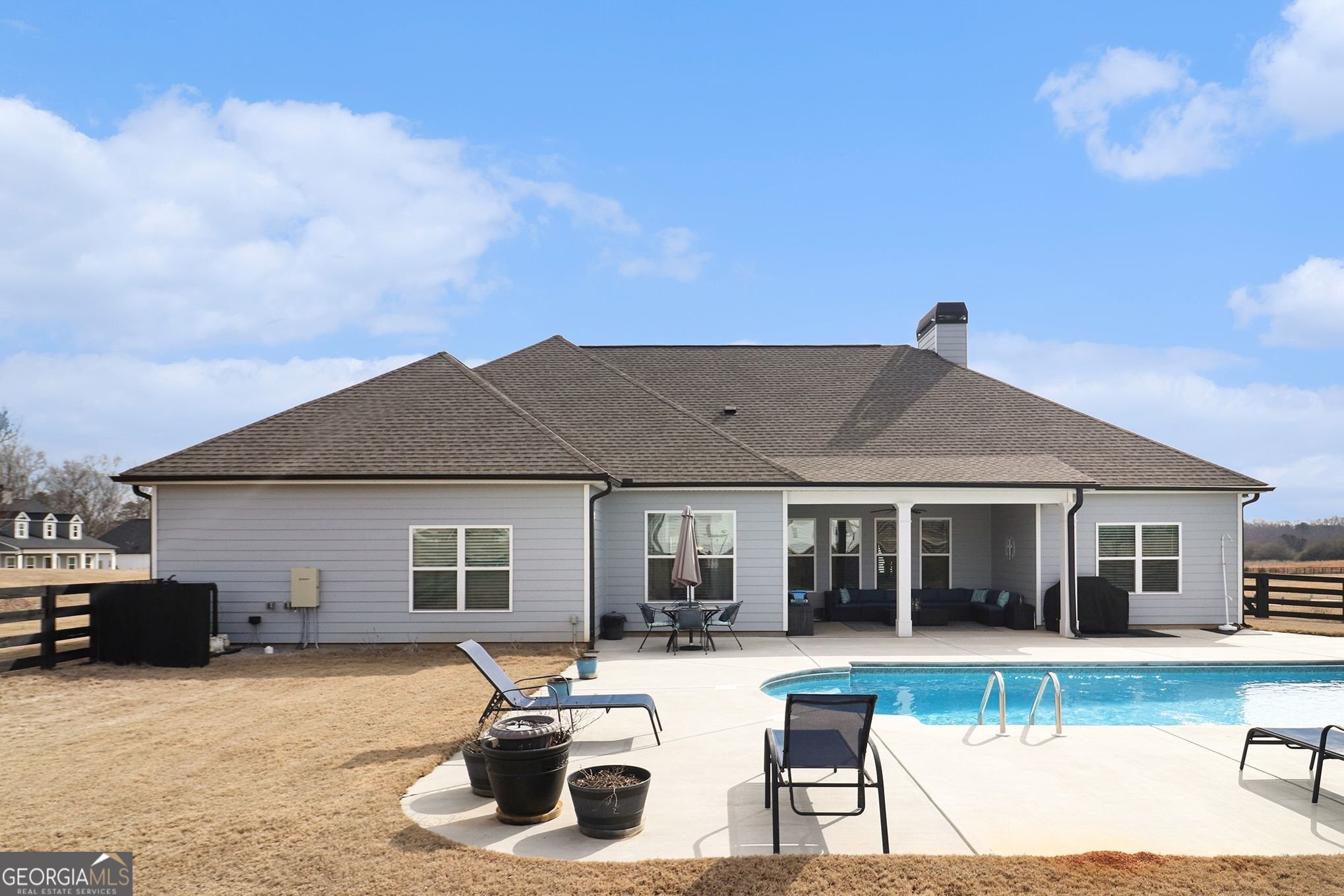 9 Union Street Newnan, GA 30263 - Photo 10 of 31 a front view of a house with swimming pool and furniture