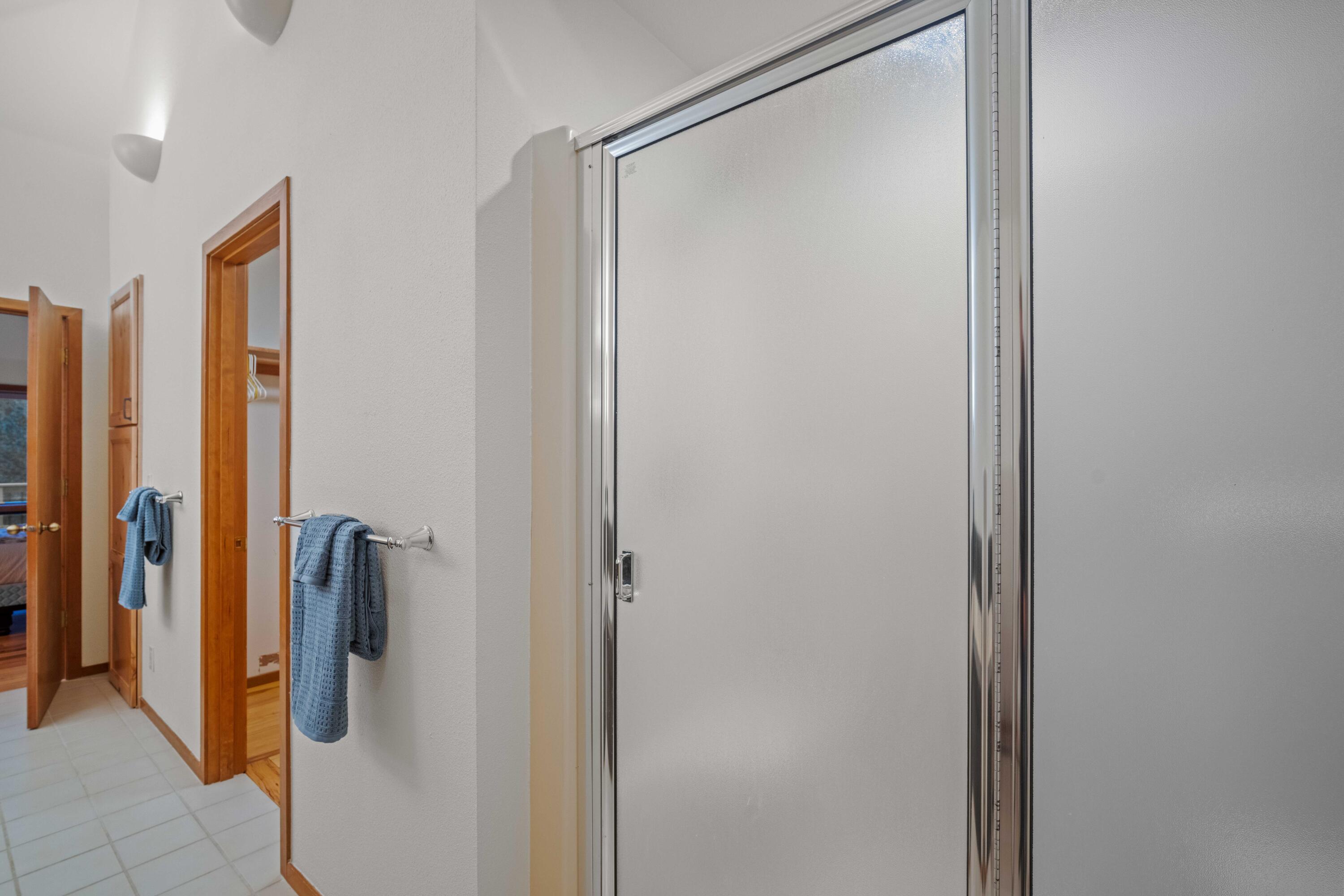 17674 Bittern Lane, Unit 7 Sunriver, OR 97707 - Photo 21 of 43 Glass shower enclosure in the primary bathroom.