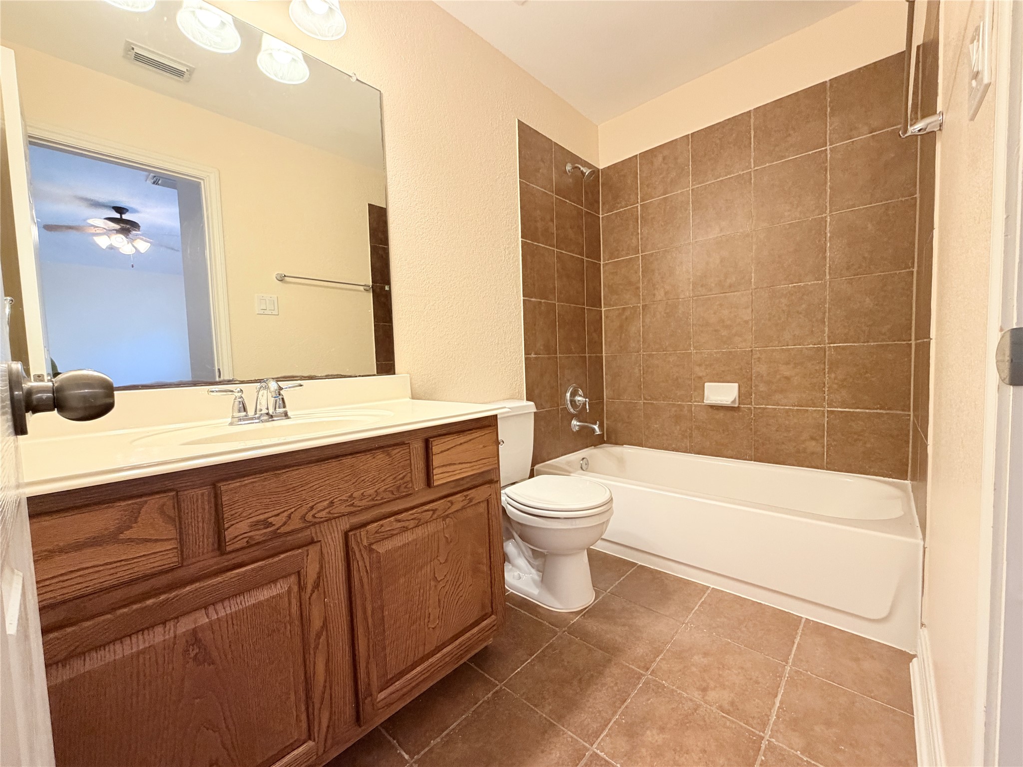 28015 Silverstream Court Fulshear, TX 77441 - Photo 24 of 33 a bathroom with a double vanity sink toilet and shower