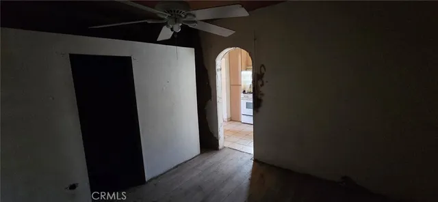 a view of hallway with wooden floor