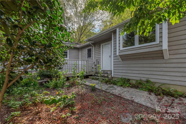 a small white house with a outdoor space